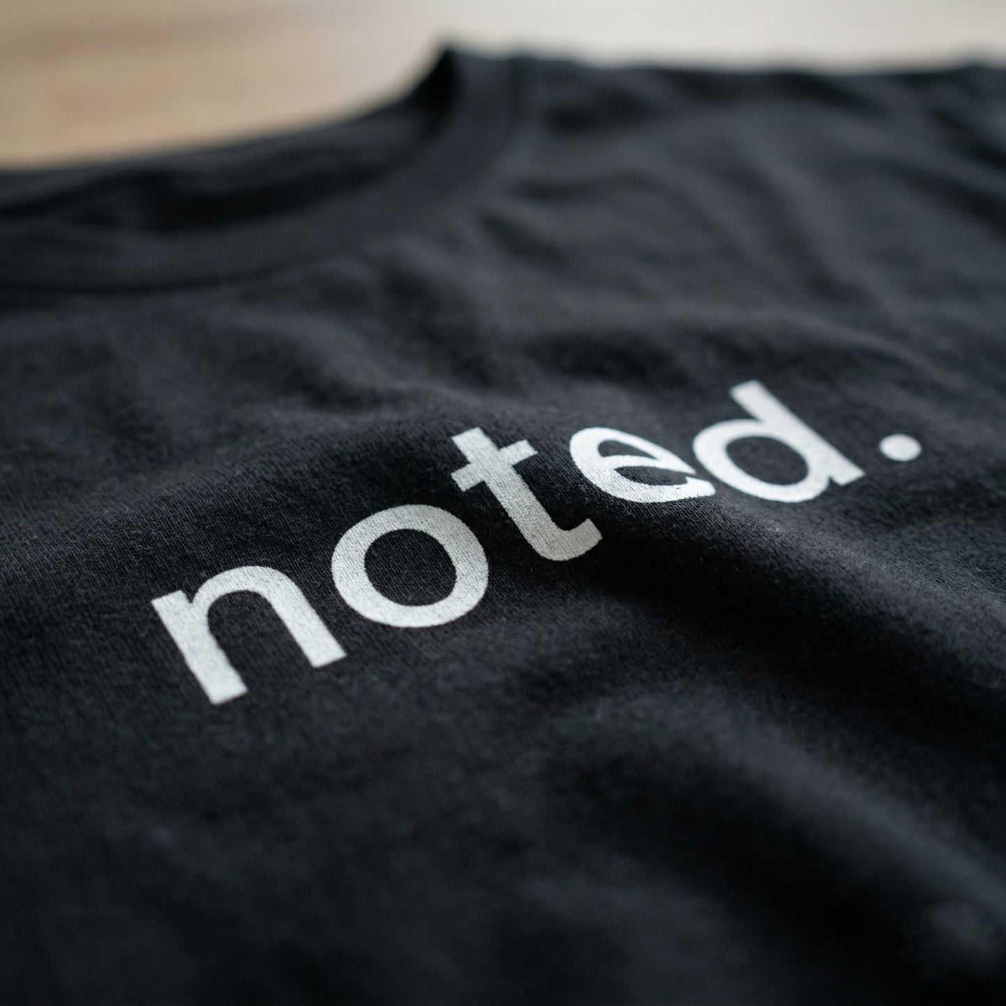 Noted. Tee – Minimal Corporate Humour T-Shirt